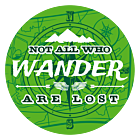 Customizable green vinyl circle sticker that reads "not all who wander are lost" with compass and map in the background