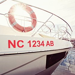 Boat registration numbers applied to a boat that has been docked at the bay.