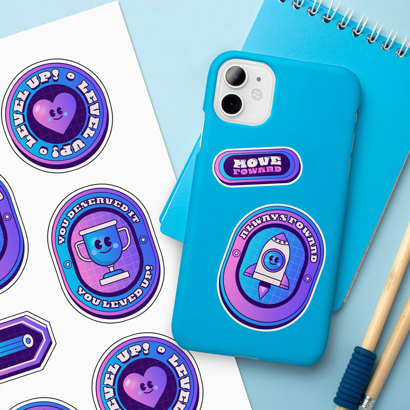 Video game-inspired sticker sheet with a phone case decorated in matching designs.