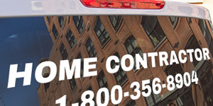 White vinyl lettering applied to the back of a white pickup truck window that reads, Home Contractor 1-800-356-8904.