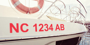 Red boat state required registration numbers applied to the hull of the boat.